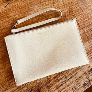 KATE SPADE white wristlet. Large enclosure to hold all your items!